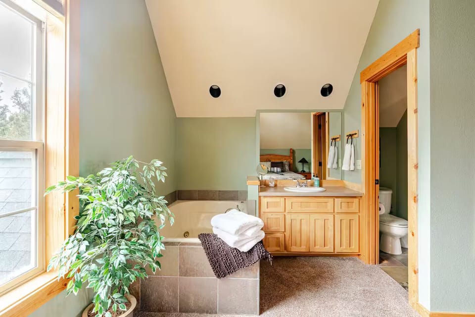 Bathroom includes shower and jacuzzi tub.