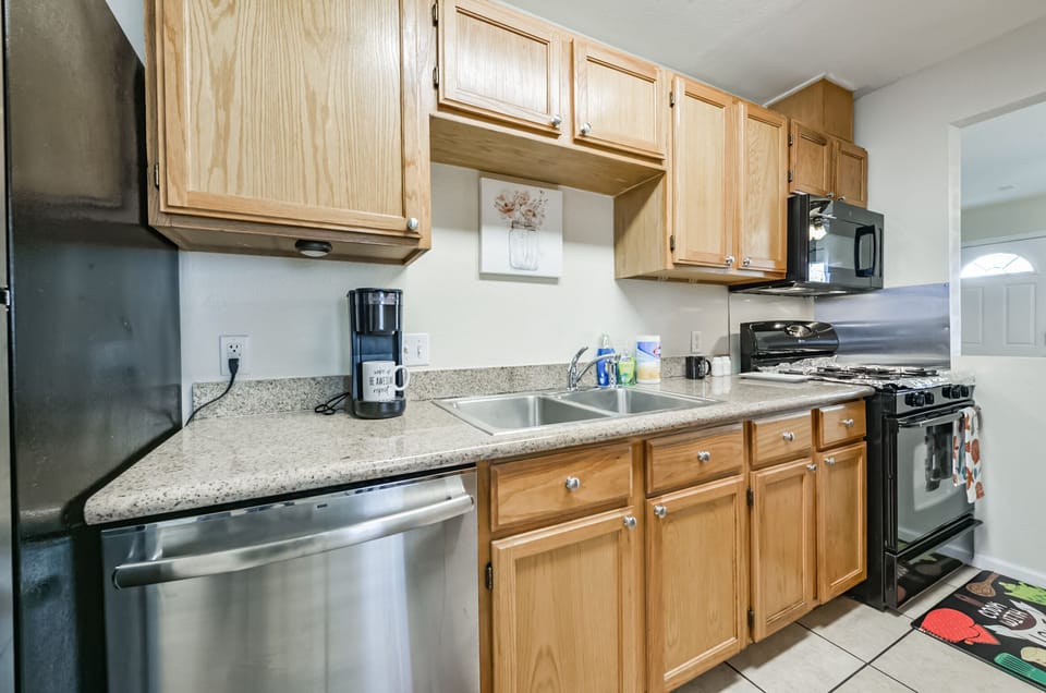 Full kitchen with stove, microwave, dishwasher, and fridge.  