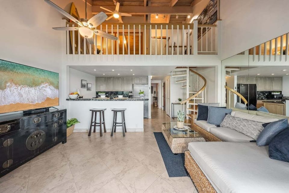 Stylish open-concept living space with modern kitchen and cozy lounge