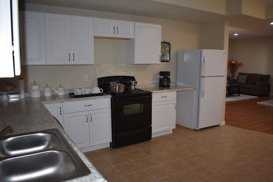 Basement fully furnished kitchen where guests cook