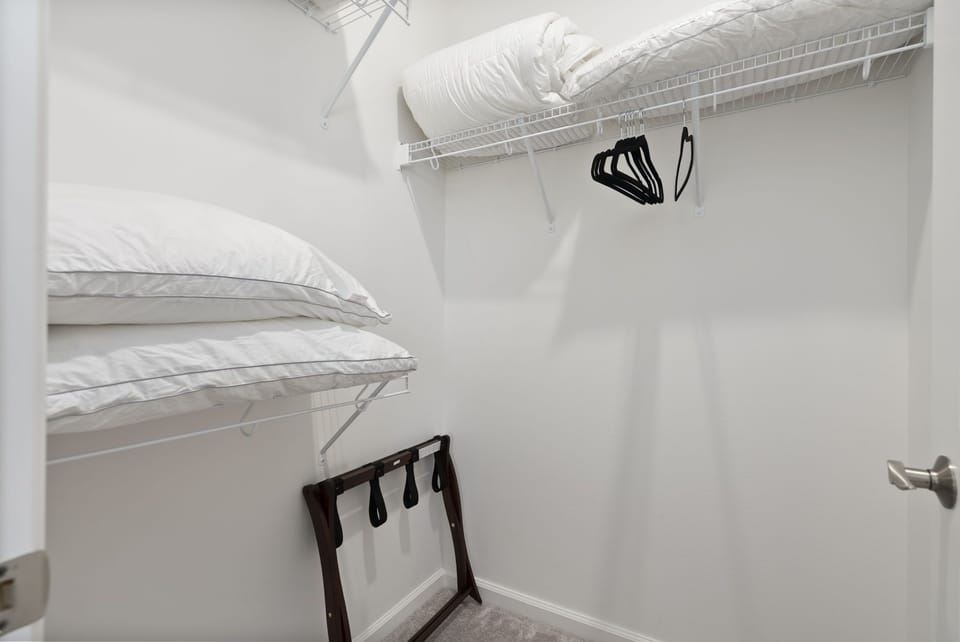 Primary bedroom's walk-in closet.