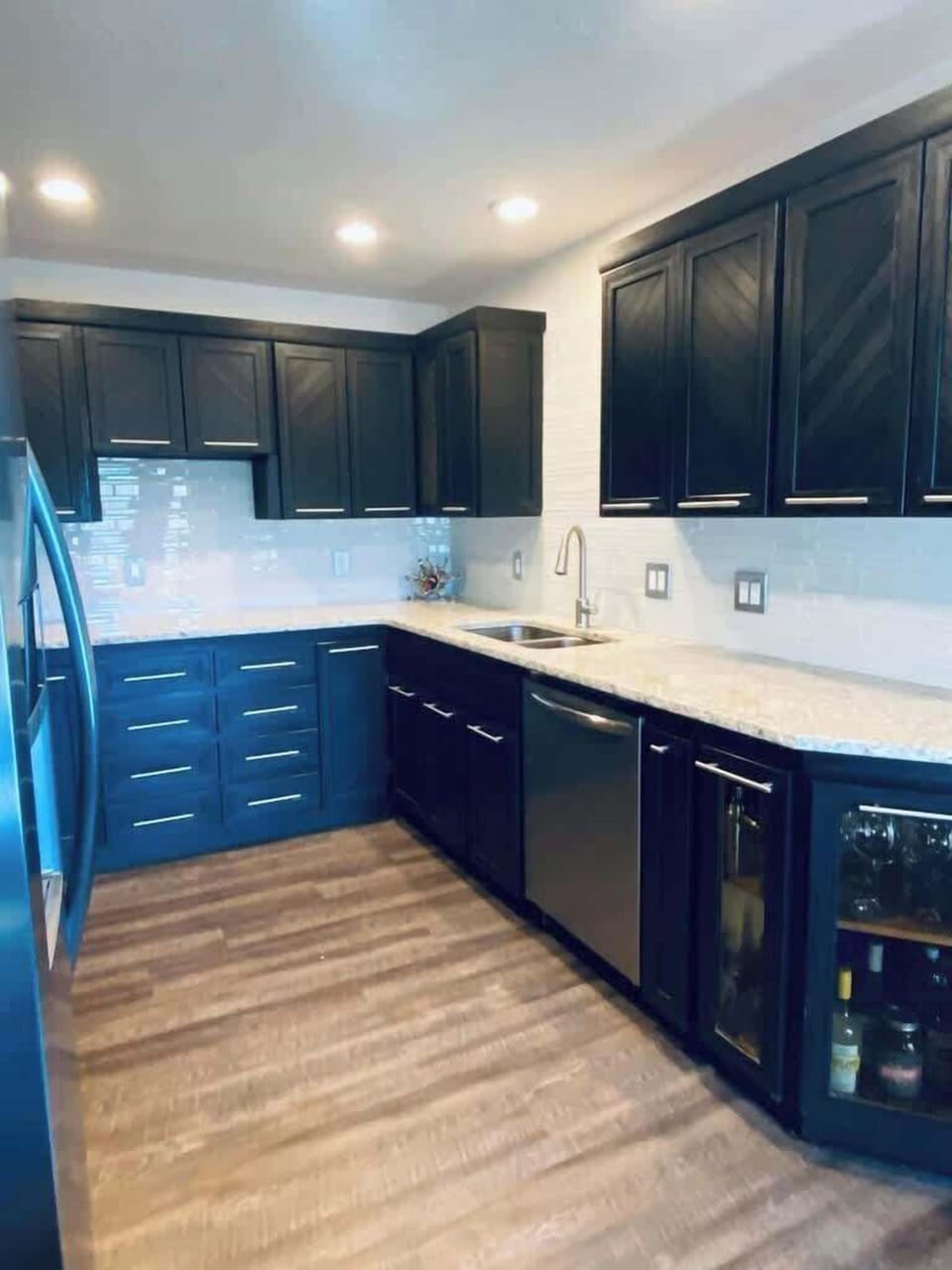 Cook up a storm in this spacious, modern kitchen. The elegant cabinetry, stainless steel appliances, and ample counter space provide everything you need for creating delightful culinary experiences.
