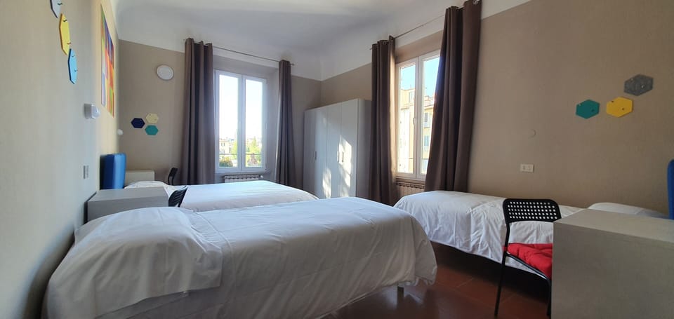 Quadruple Room | Down comforters, desk, laptop workspace, blackout drapes