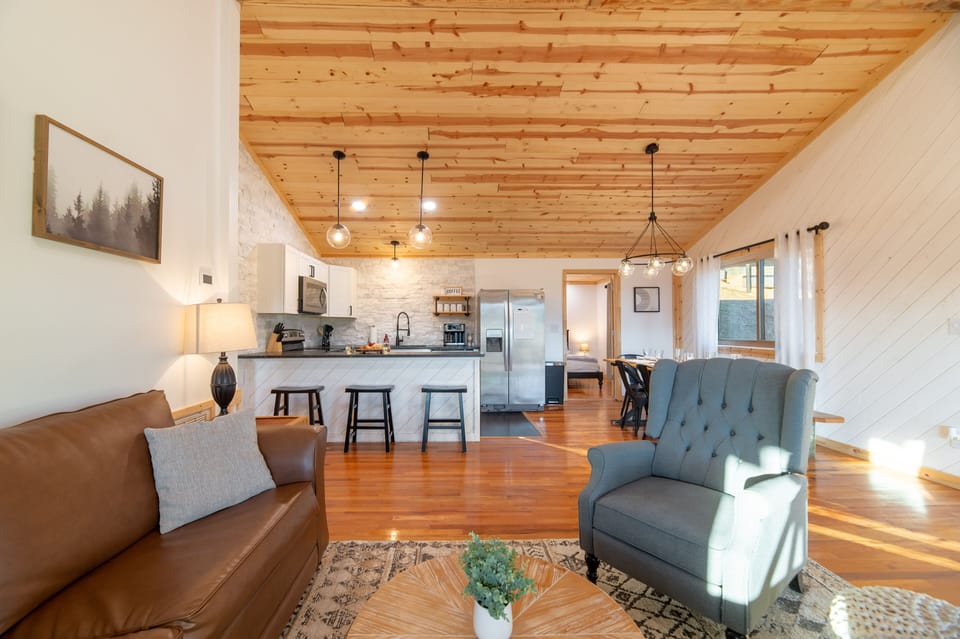 Living room area, and kitchen.