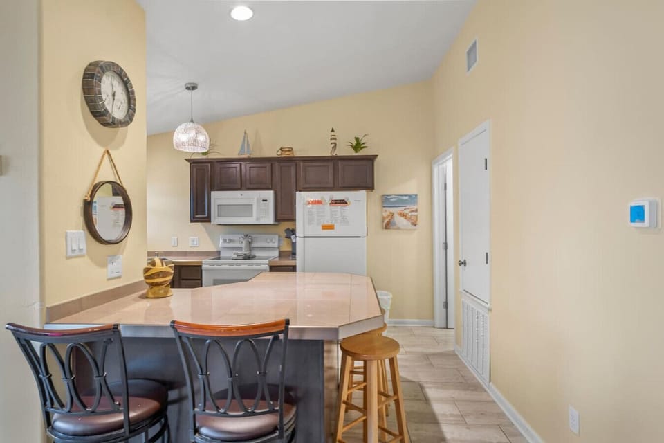 Open-Concept Kitchen – Cook, sip, and chat at the breakfast bar while staying connected.