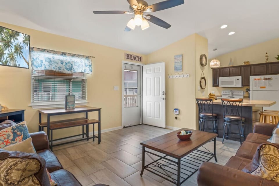 Bright & Airy Living Room – Kick back after the beach in this cozy open-concept space.