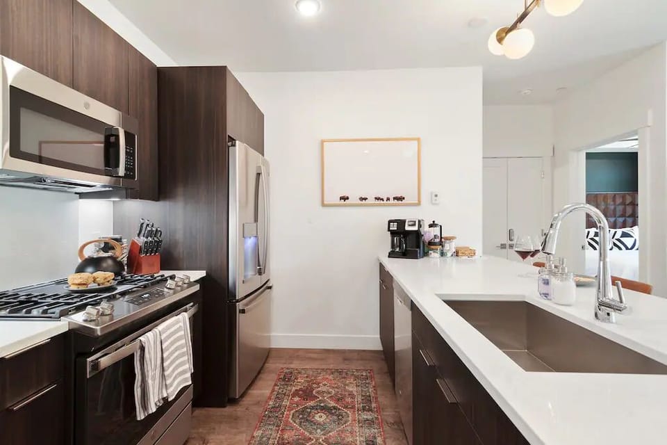 Stocked Beyond — New appliances plus thoughtful extras—coffee, oils, spices, paper goods, and more for effortless stay-in meals. ☕️🫒