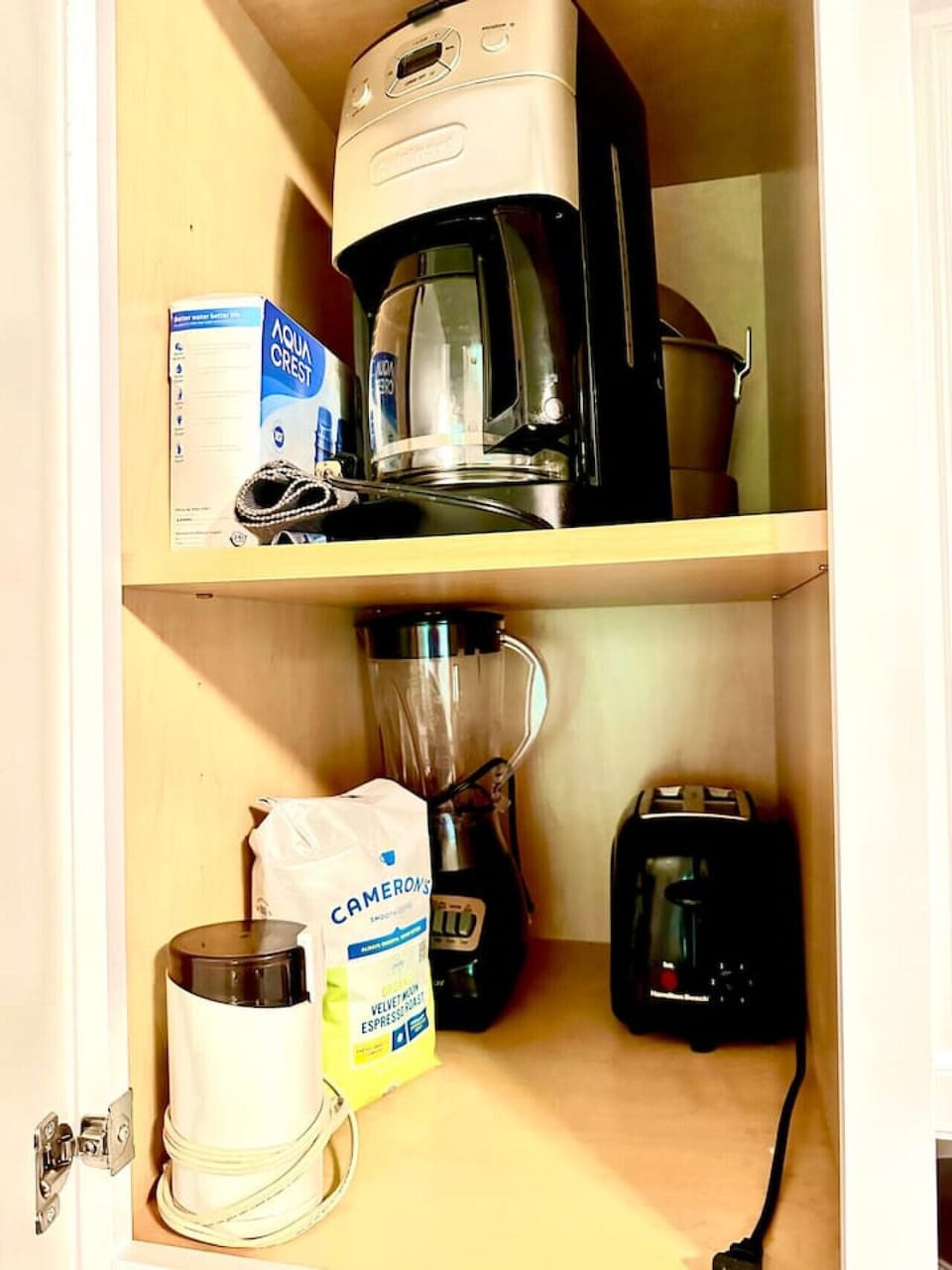 Cuisinart coffeemaker grinds your beans (provided). A toaster, blender, and Crock Pot, and coffee grinder are also ready for you.