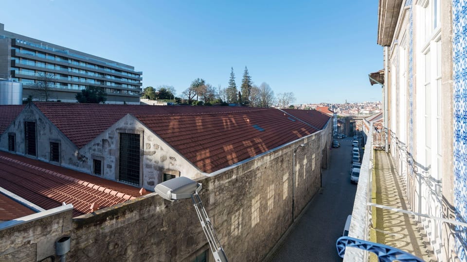 Enjoy a glimpse into the city's unique architecture and a sun-drenched street view right from your private balcony.
#Cityscape #BalconyView #LovelyStay