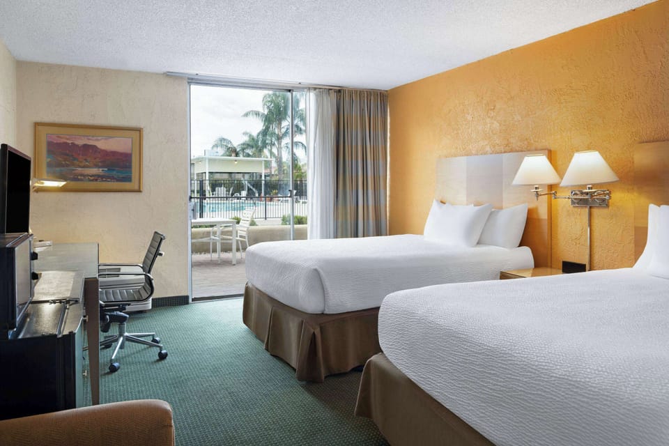 Room, 2 Queen Beds, Non Smoking | In-room safe, desk, laptop workspace, blackout drapes