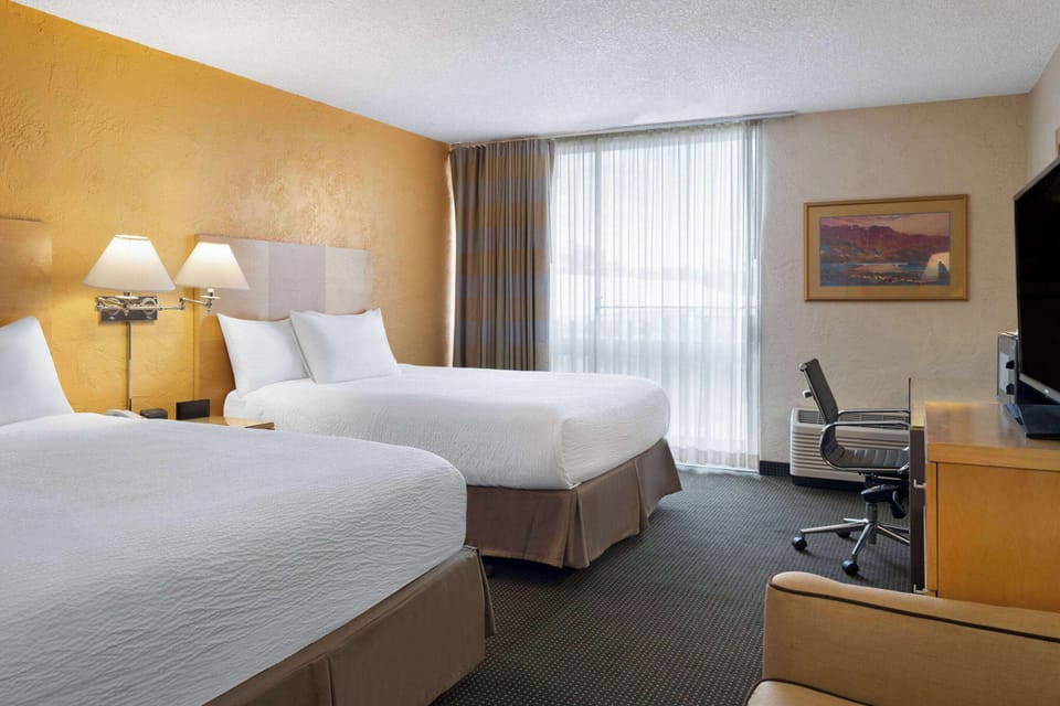 Deluxe Room, 2 Queen Beds, Non Smoking, Courtyard View | In-room safe, desk, laptop workspace, blackout drapes
