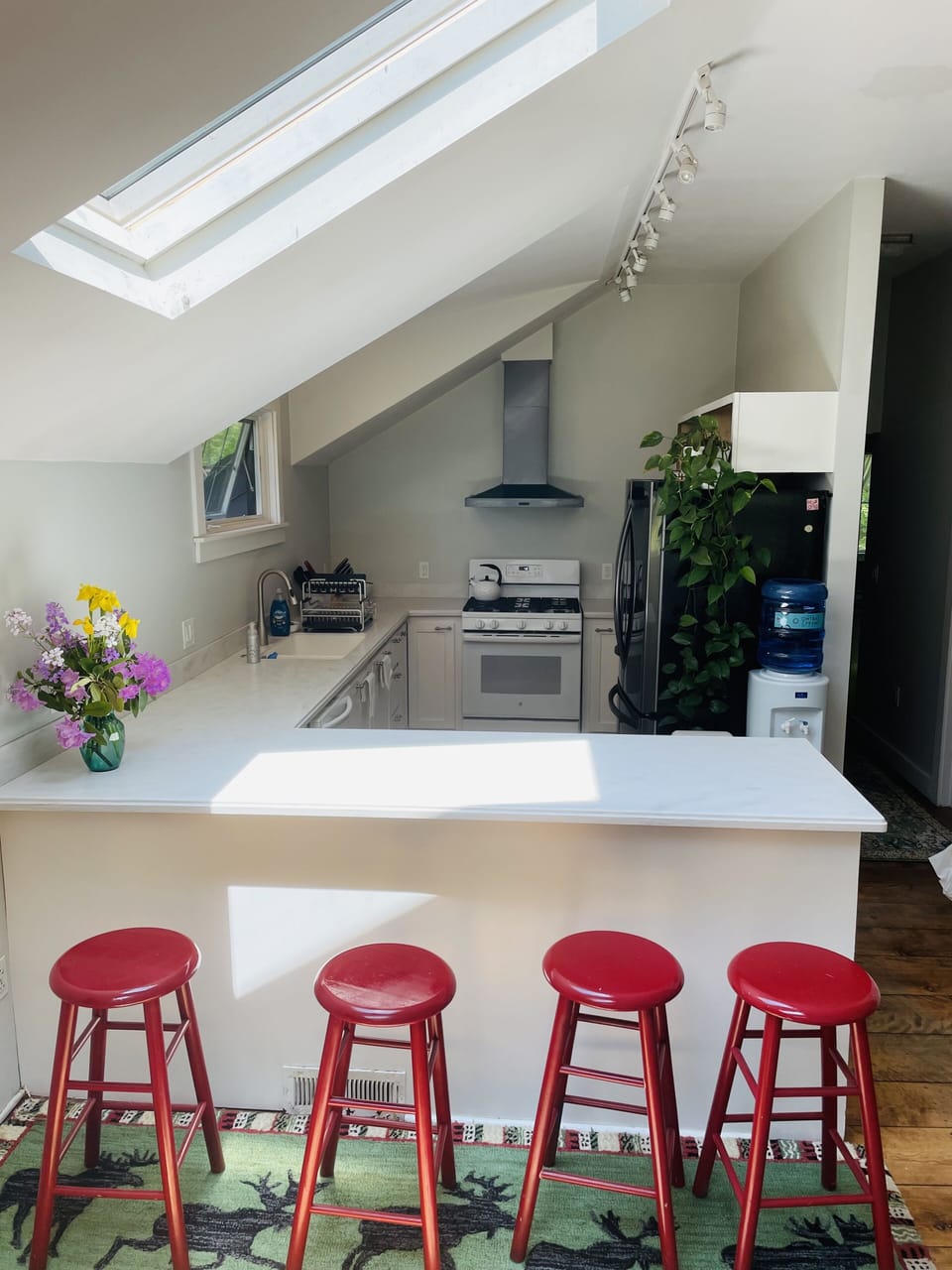 Well-stocked, cheerful kitchen is open to the great room.  Visit while you cook!
