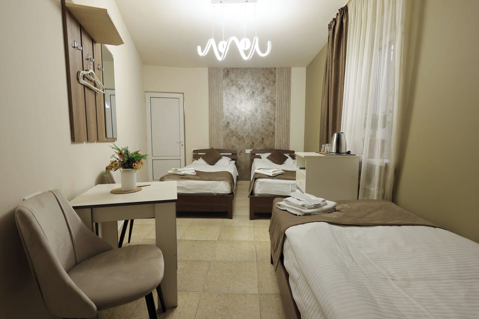 Elite Triple Room | Desk, blackout drapes, iron/ironing board, free WiFi