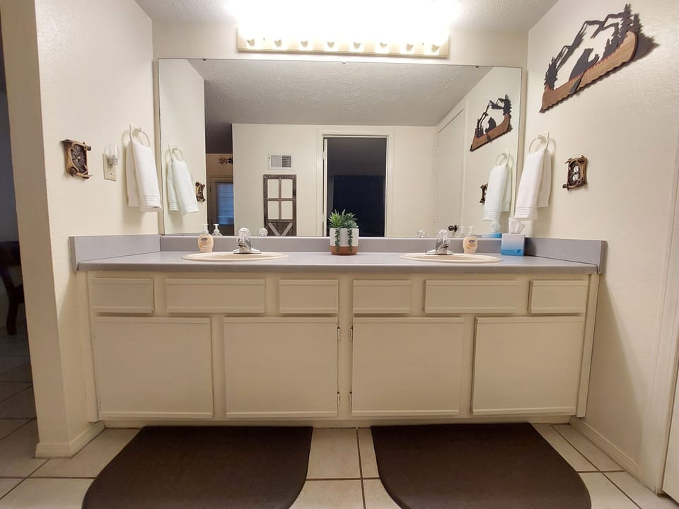 Spacious Master Bathroom, unique decor, double sinks, memory mats, & more!