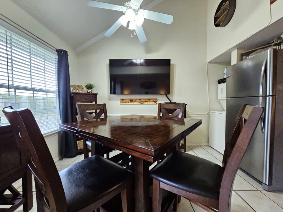 Spacious dining area with all the comforts of home and a huge 65-inch Smart TV!