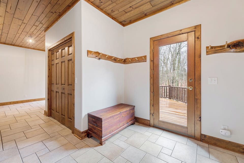 A warm, welcoming entry with custom wood details and easy access to the deck—perfect for coming and going between nature and comfort