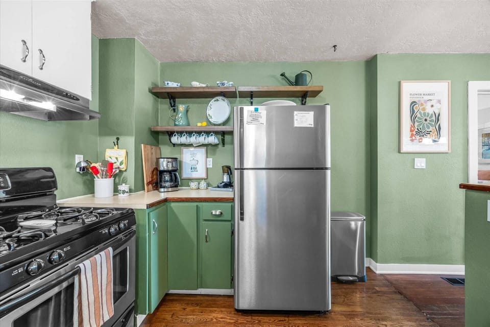 Well-appointed quaint cottage kitchen with stainless steel appliances