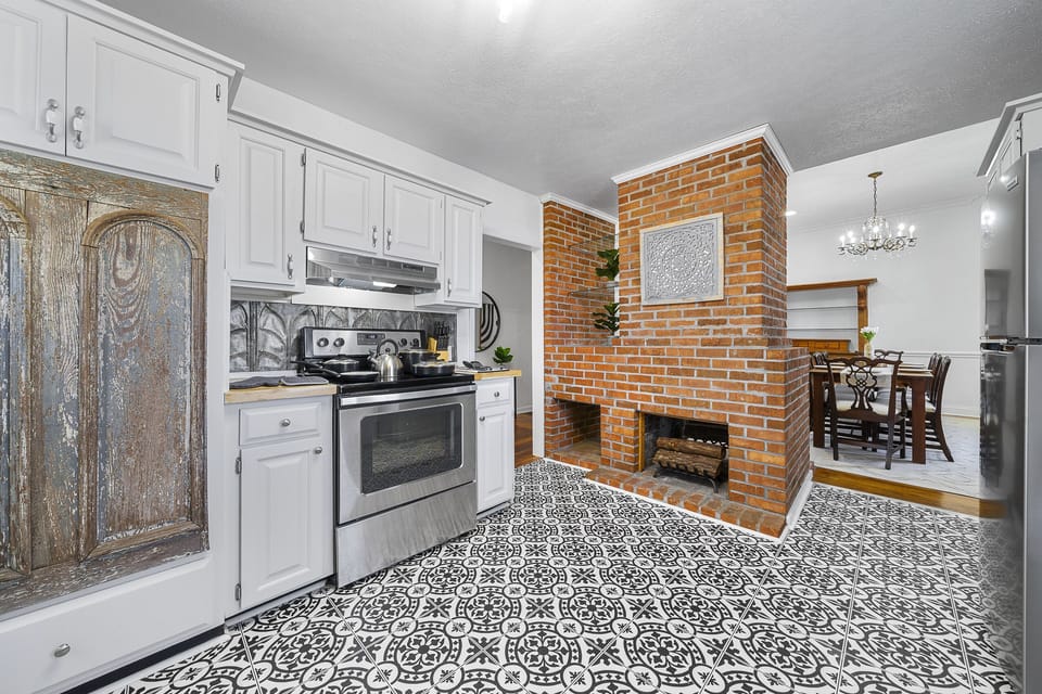 Prepare your family's meals in this unique kitchen designed with antique pieces.