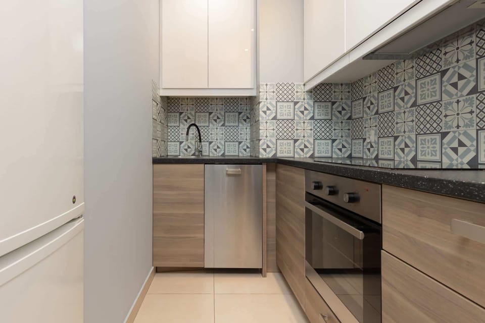 Another angle of the kitchen, emphasizing functionality and storage.
