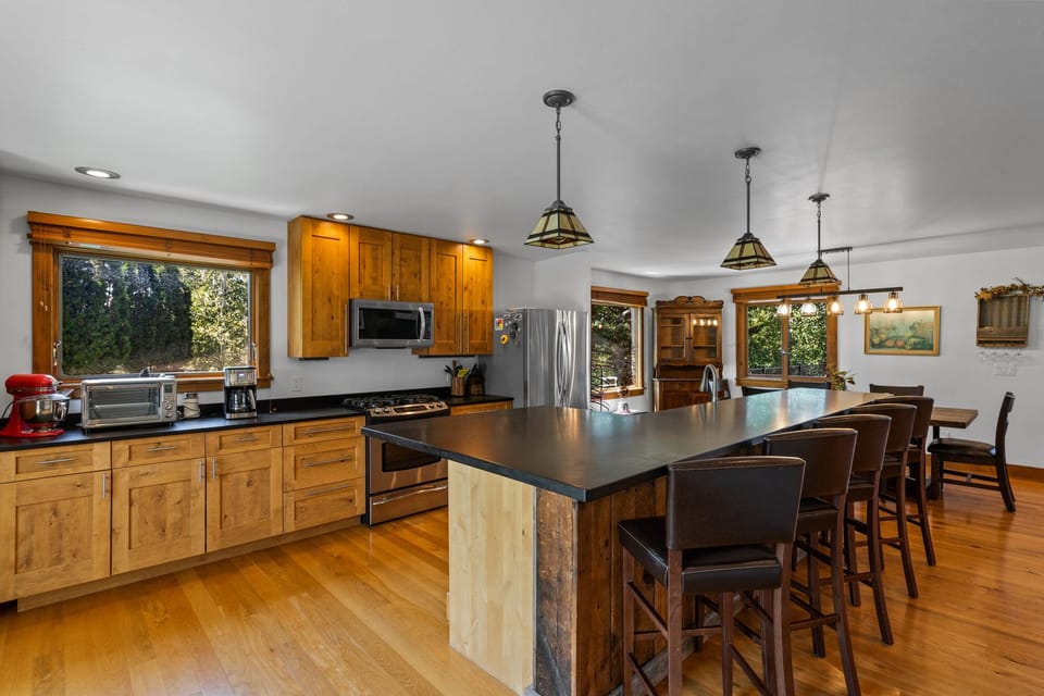 Five seats available at the kitchen island bar.