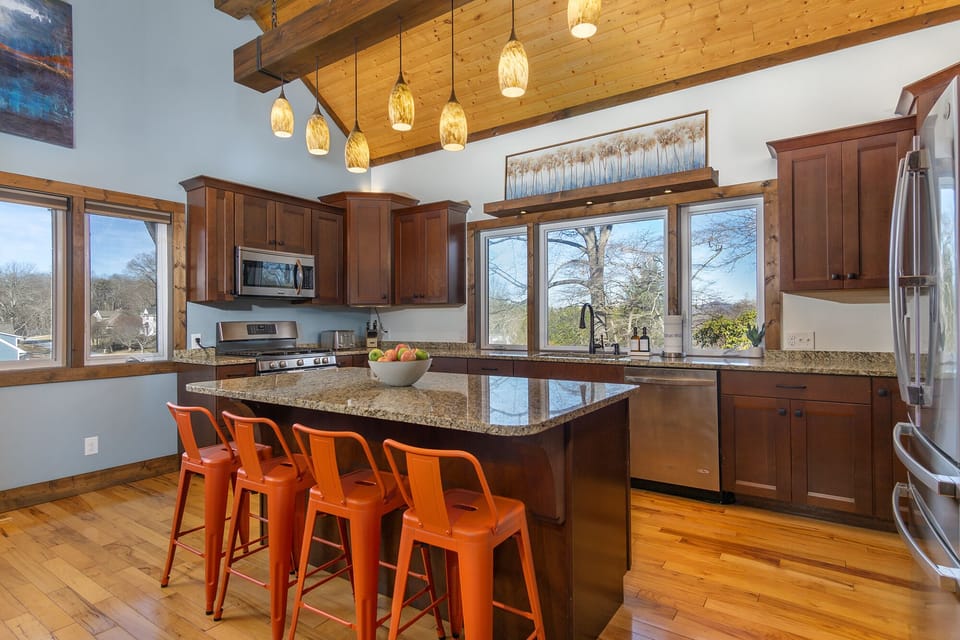 Spacious kitchen and island seating makes it a wonderful place to congregate.