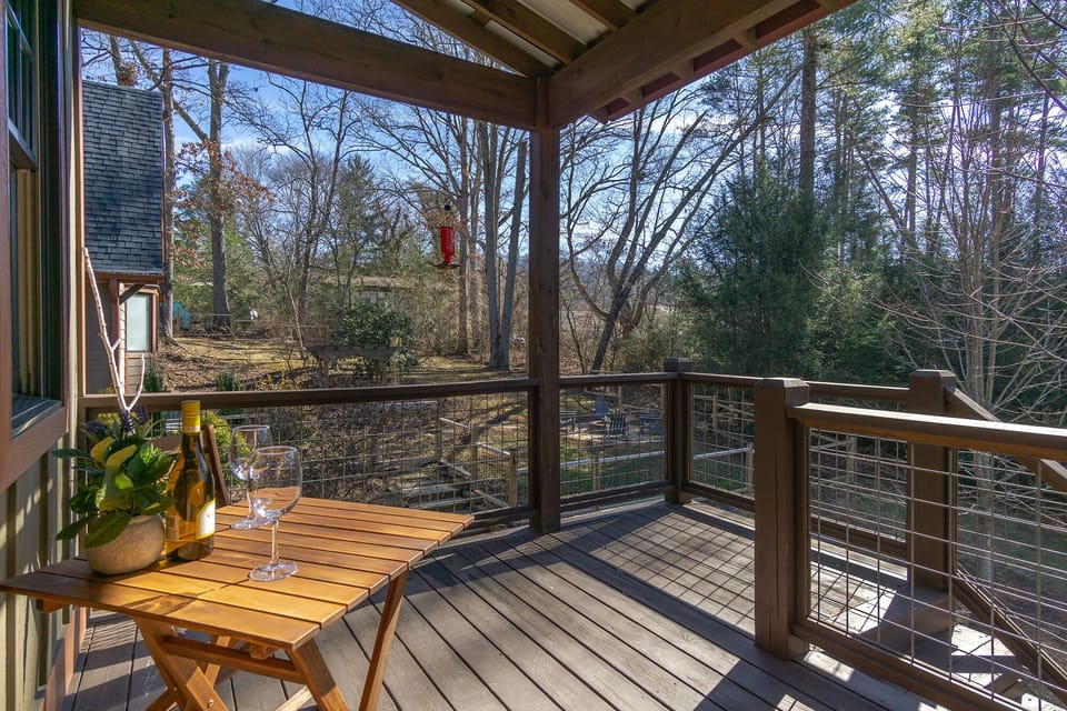 View of the private backyard with stairs leading down to the firepit.