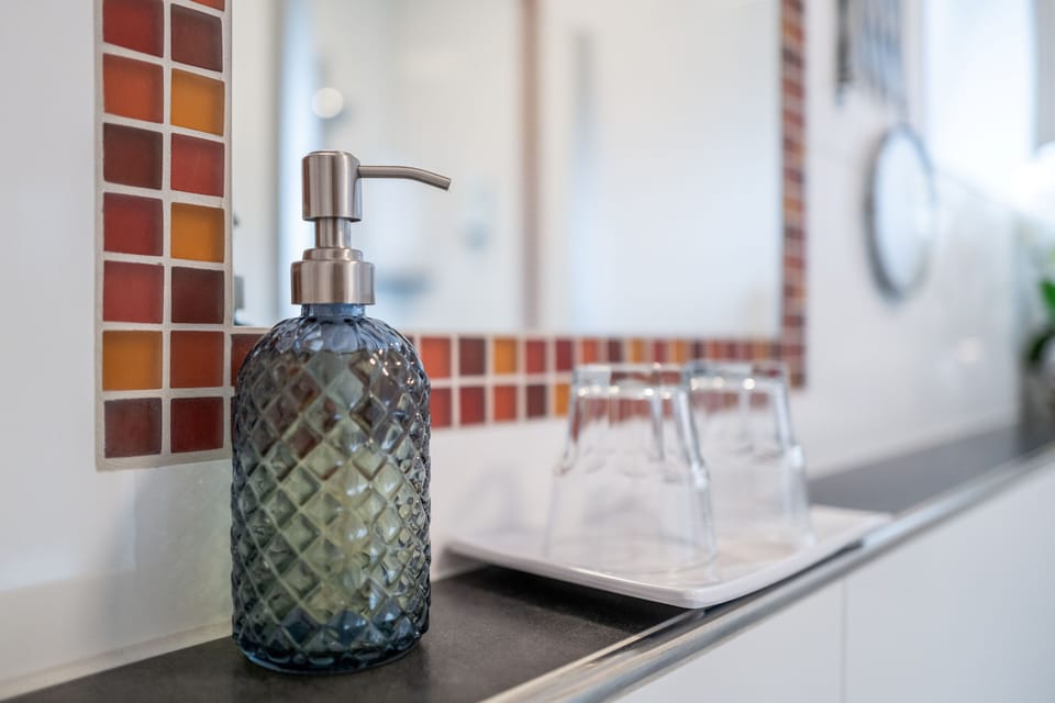 Dinner for One Room | Bathroom | Hair dryer, slippers, soap, shampoo