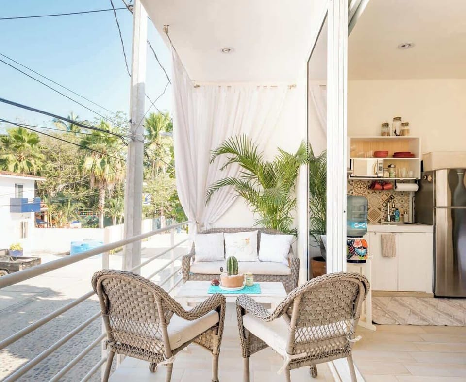 Large private balcony with views of the colorful street below