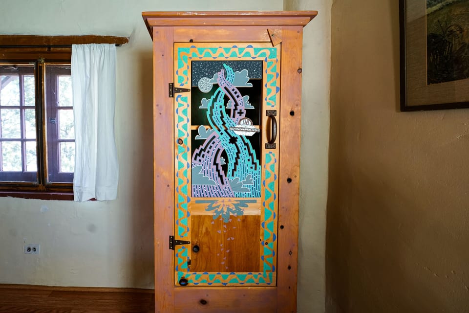 A wooden cabinet in a room.
