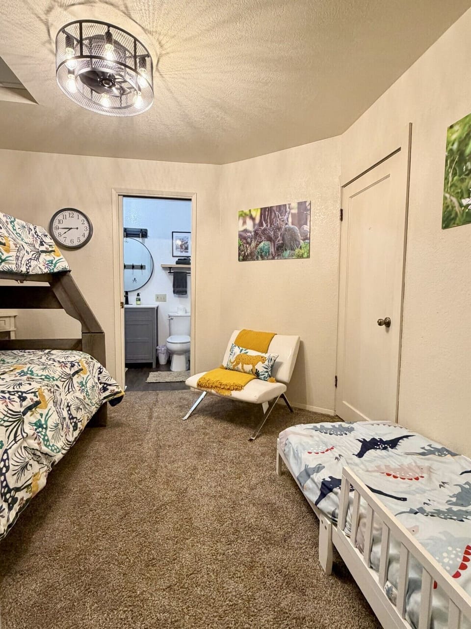 The bunk room features a twin-over-full bunk bed, making it ideal for children, teens, or additional guests.