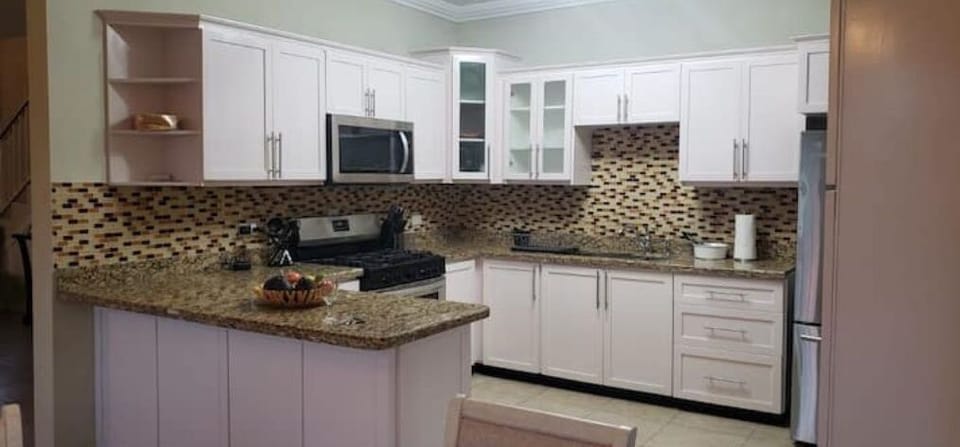 Big  kitchen, stainless steel fridge, microwave, gas stove,  smaller appliances 
