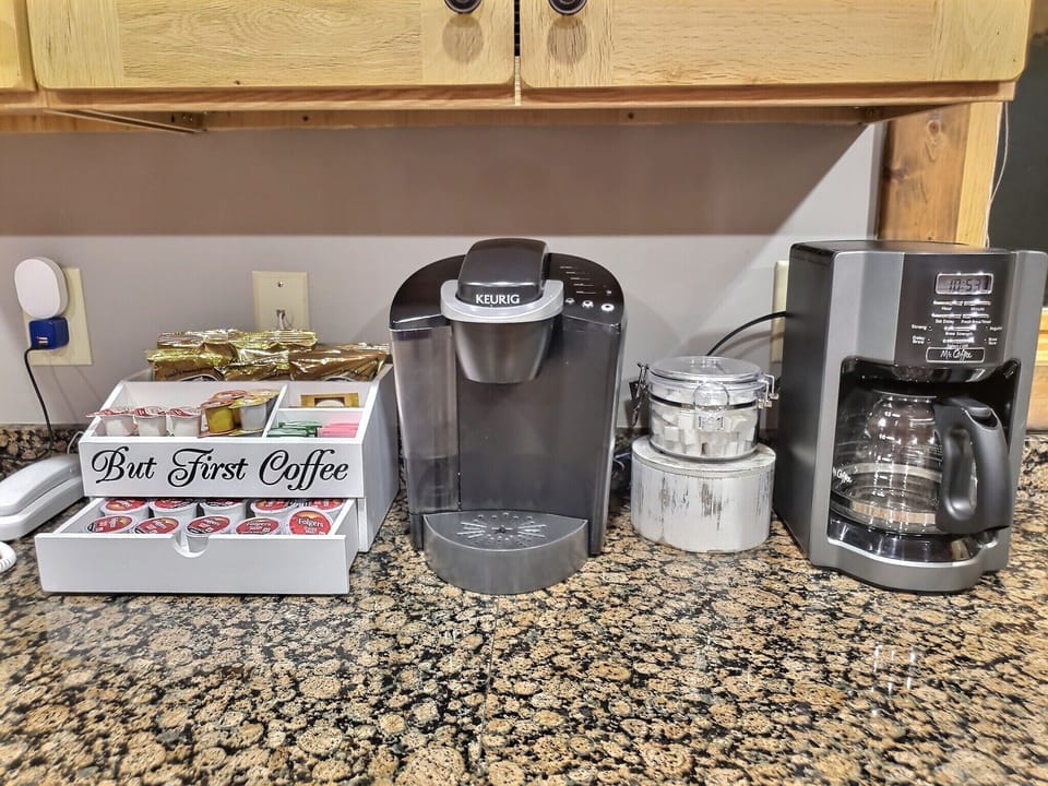 Coffee/tea station with drip coffee maker and Keurig coffee maker.