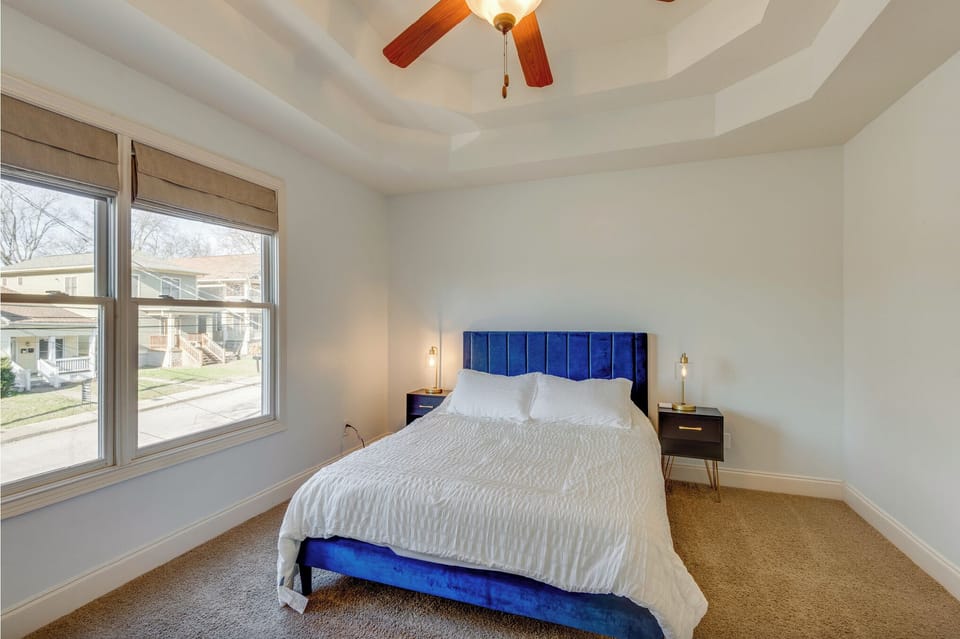 Another view of the queen bedroom and tap to turn on lamps on beside tables.