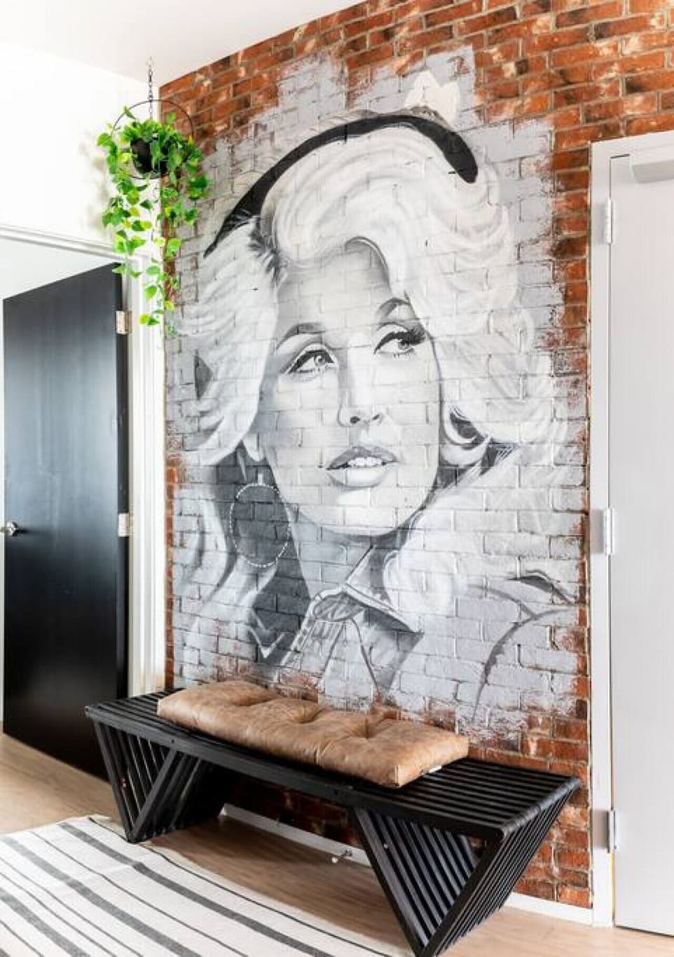 Enjoy taking photos in front of our custom Dolly Parton mural!