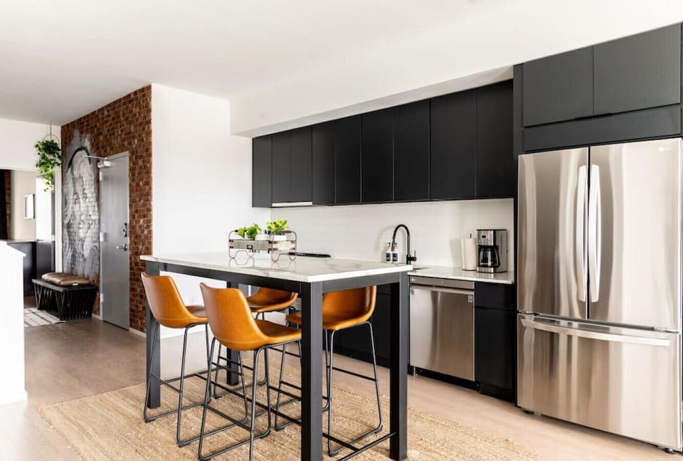 Fully equipped kitchen for all of your cooking needs! Two dining tables available to sit at.