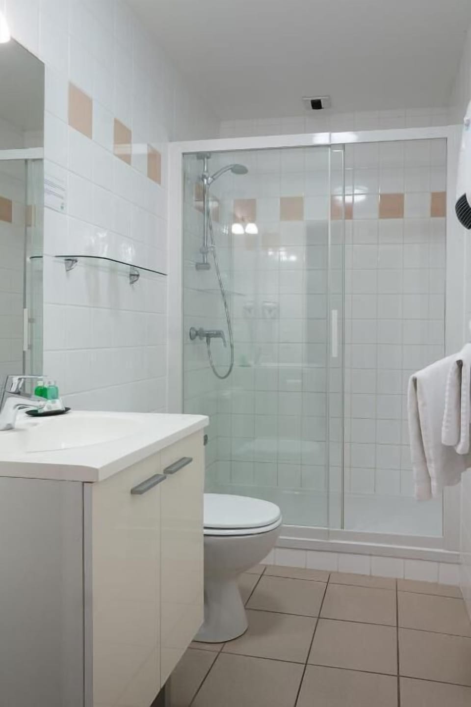 Shower, rainfall showerhead, designer toiletries, hair dryer