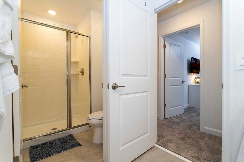 Shared second-floor hallway restroom #3.Spacious shower and double sinks 