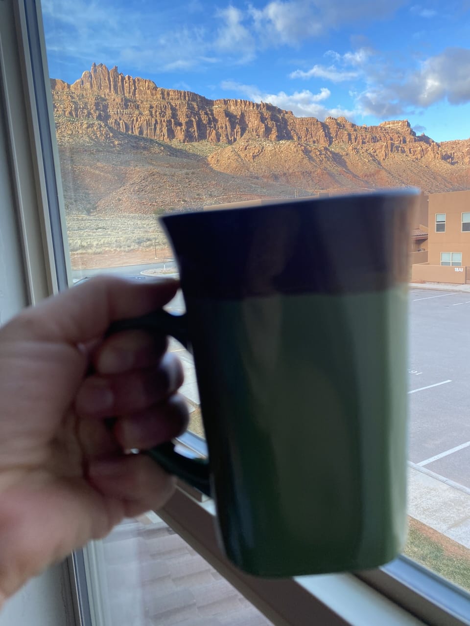 Morning coffee with Moab rim view