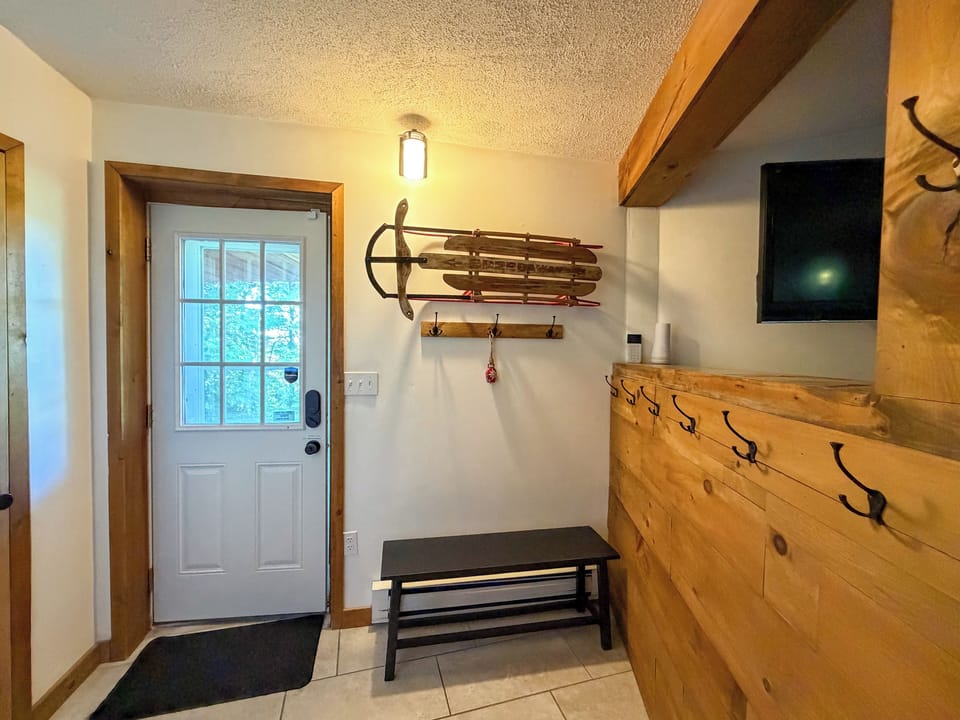 Mudroom at basement entry. Lots of space for all the things.