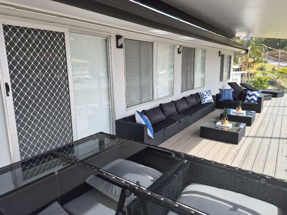 Upstairs Front Balcony : The upstairs front balcony adds one of Skye’s Beach House’s key outdoor areas, positioned toward the Malua Bay Beach side of the property.