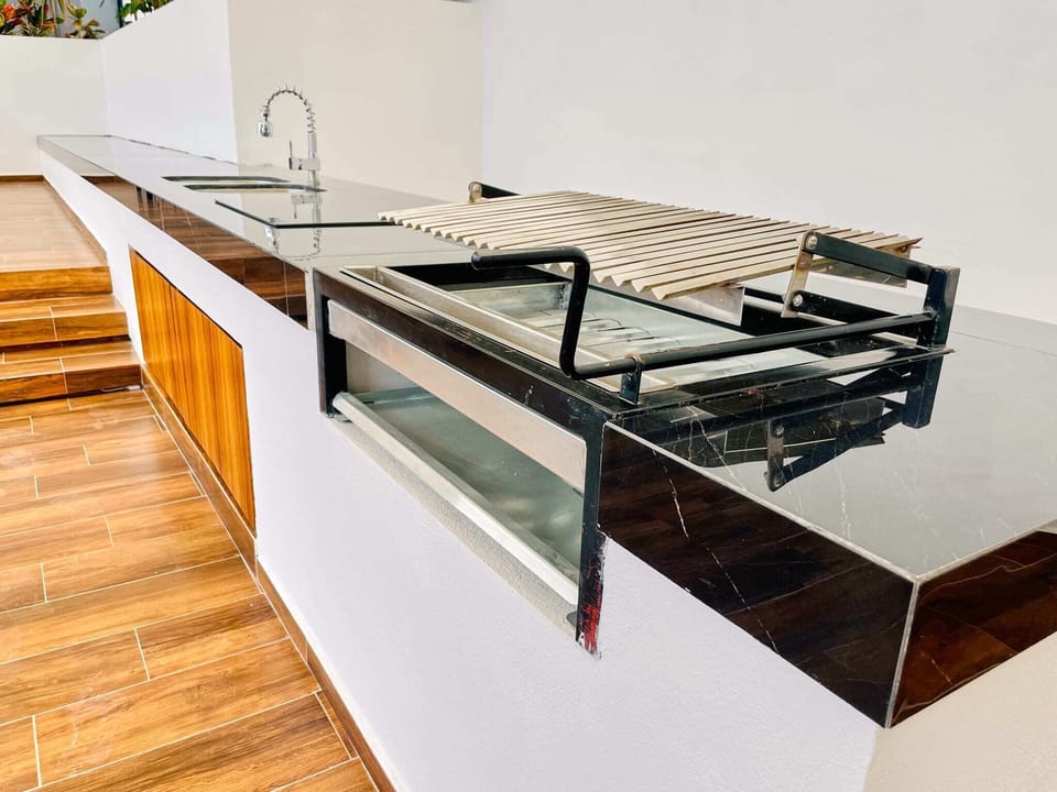 Bottom floor pool area with Argentina-style charcoal grill