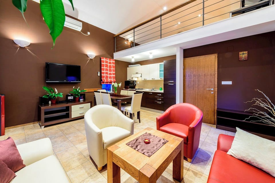 Open plan living room with kitchen and dining area