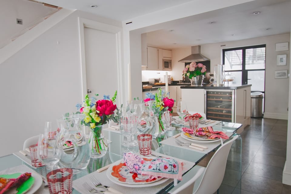 The dining area leads seamlessly to the main kitchen