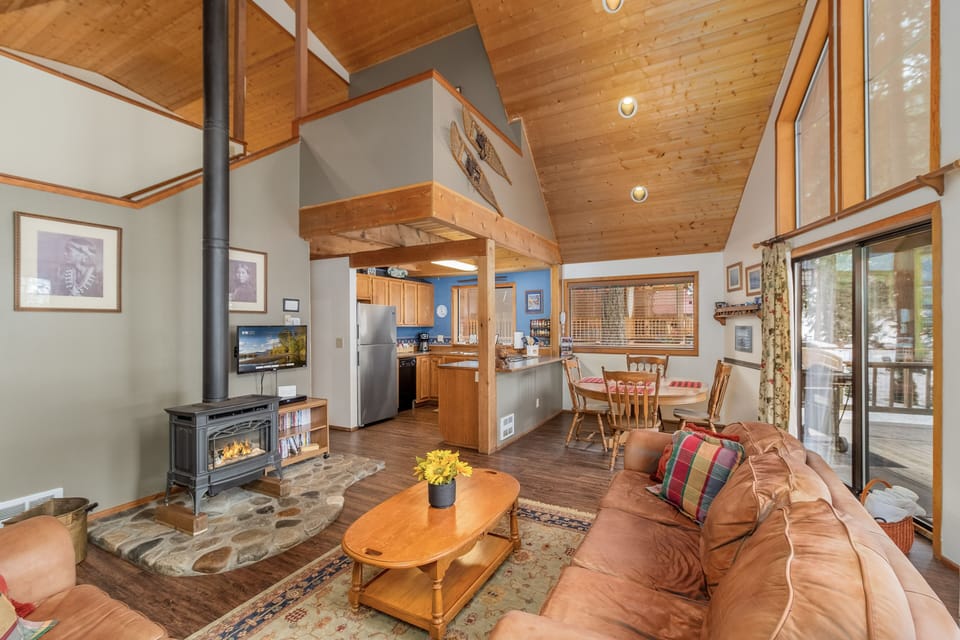Gather in the two story great room around the propane fireplace.