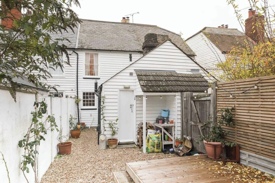Wild garden with sun loungers & table & chairs
