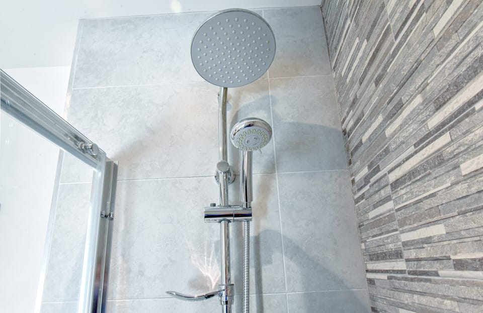 En-suite bathroom in 1st Double Bedroom with walk in rain shower, WC & basin