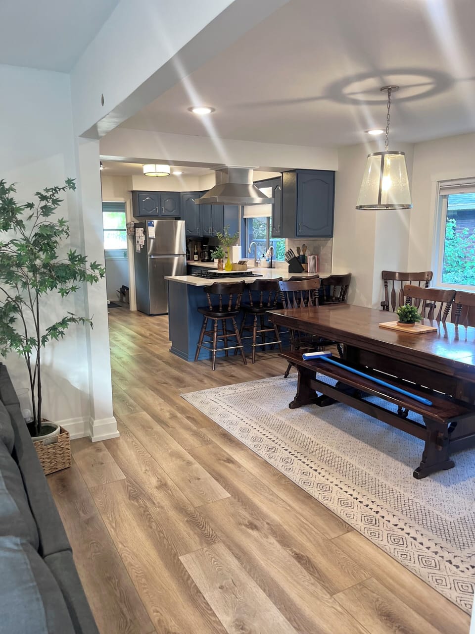 View from upstairs living room into dining room and kitchen