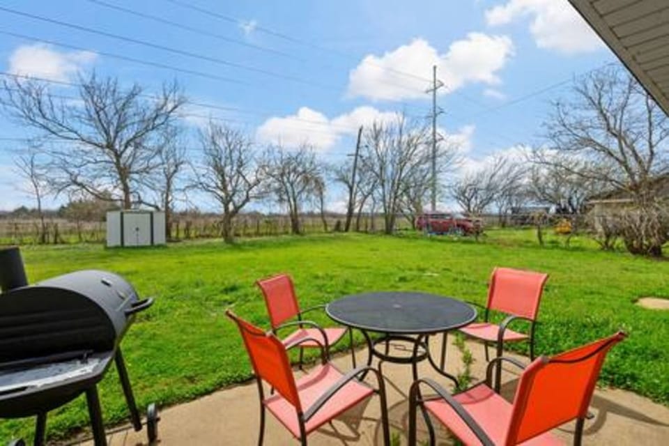 Your private patio overlooks rolling green fields, perfect for morning coffee or evening BBQ dinners under the open sky.