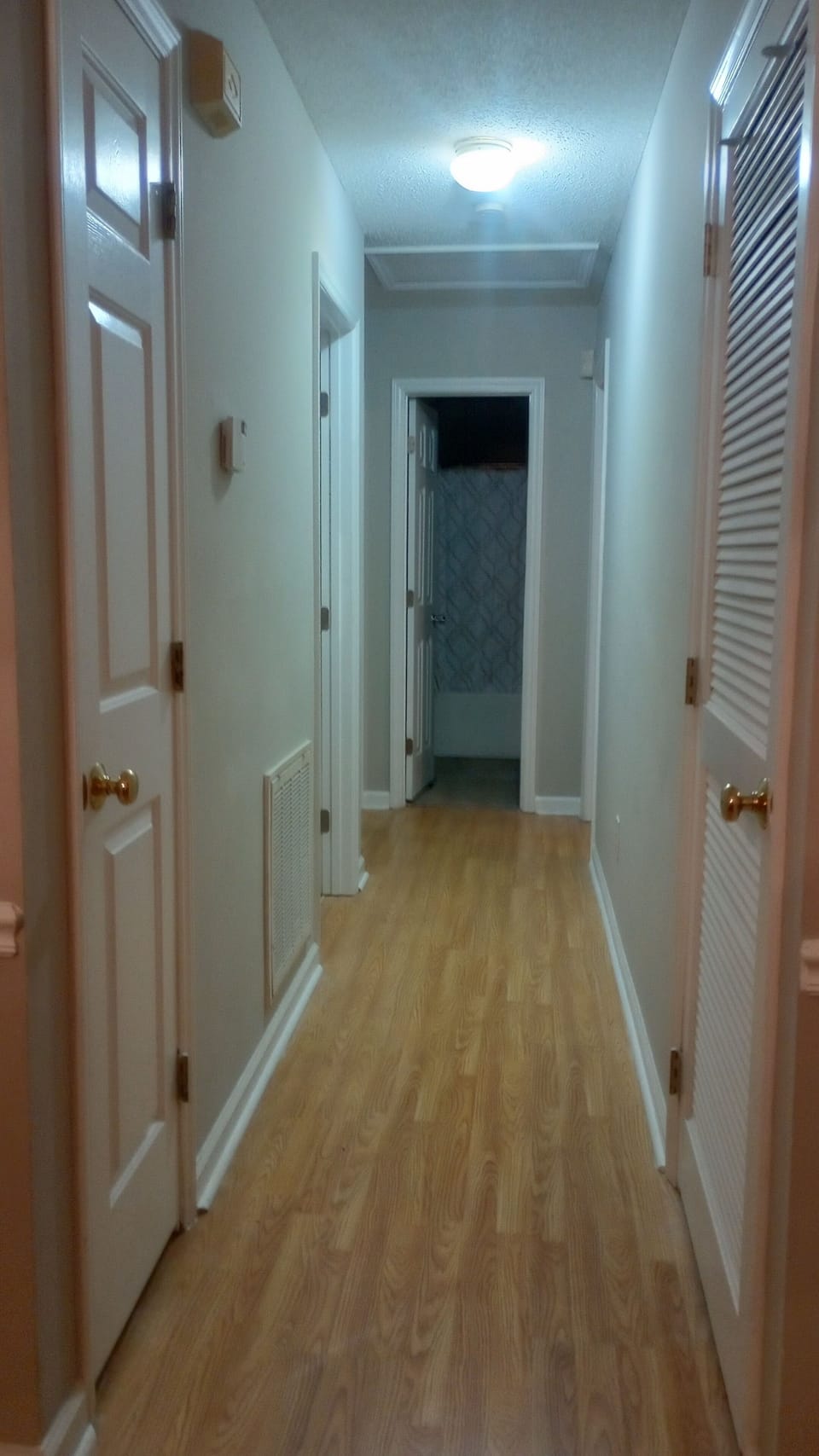 Hallway to BRs and BAs. Includes thermostat, smoke and carbon monoxide detectors