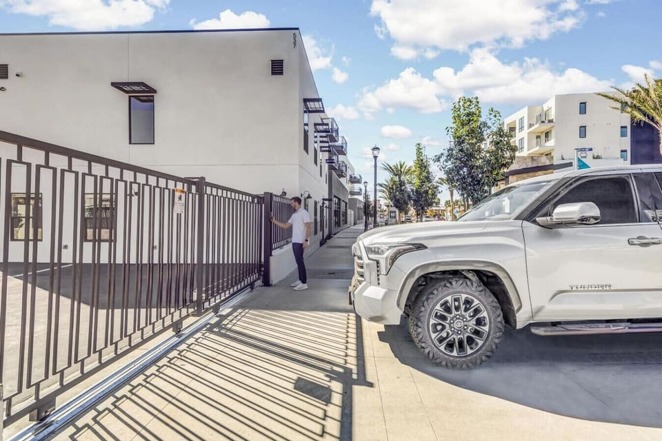 The entrance gate for the private parking with keypad access.